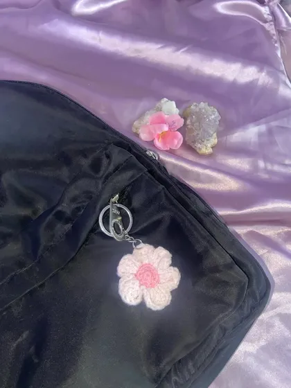 My pink and white flower charm, styled on a bag with some crystals. I can make these handmade flower keychains in different color combos.