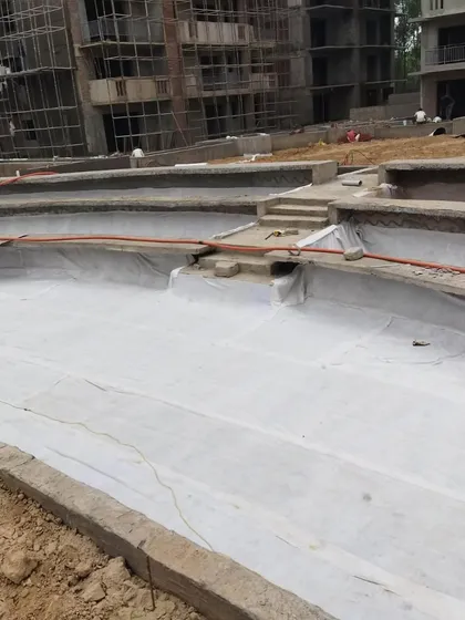 The geotextile fabric is now covering the entire planter area. The space is now waterproofed, drained, and ready for the next layers of soil and plants.