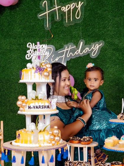 A charming 'Baby Shark' themed birthday party, featuring a vibrant underwater backdrop, character cutouts of the shark family, and blue and yellow balloons, perfect for a fun-filled celebration.