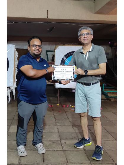 This student receives his certificate after completing the 10-day summer camp program.