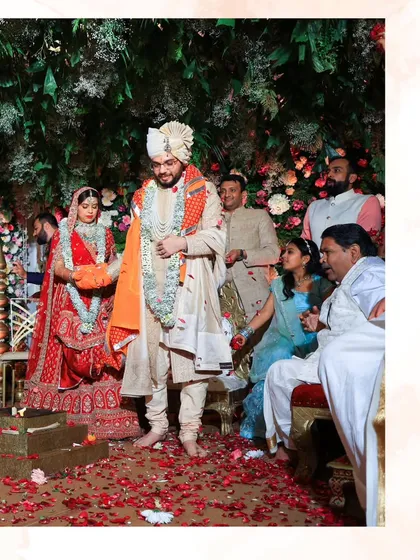 The couple taking their first steps together in the ceremony. This image captures the beginning of their sacred journey, surrounded by family and blessings.
