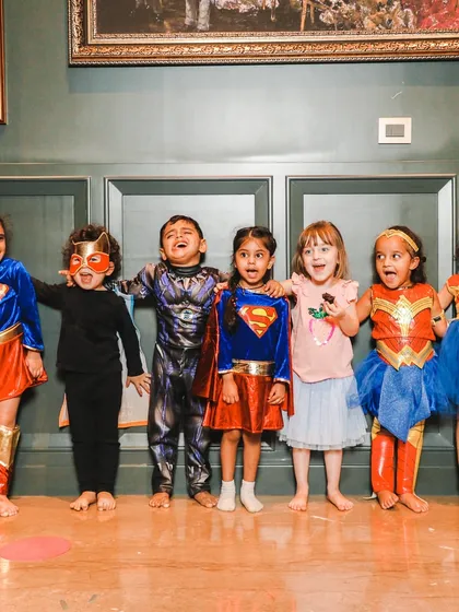 The whole superhero squad. Group photos like this capture the fun and camaraderie of our themed dance sessions.