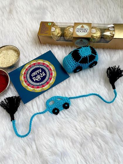 This Rakhi hamper includes a car-themed Rakhi that can be played with later, along with some chocolates. It's a fun and thoughtful gift for a little brother.