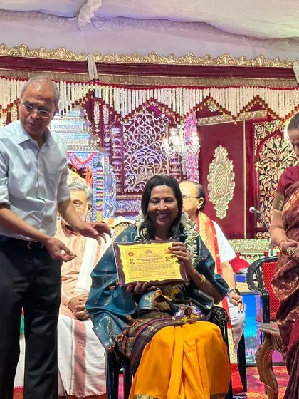 Holding the certificate of honor from the Sree Ramaseva Mandali. These recognitions inspire me to continue my work in teaching and promoting Carnatic classical music.