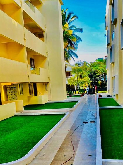 This shows a long walkway in an apartment complex that we turfed. It brightens up the space between buildings and provides a pleasant, green path for residents.