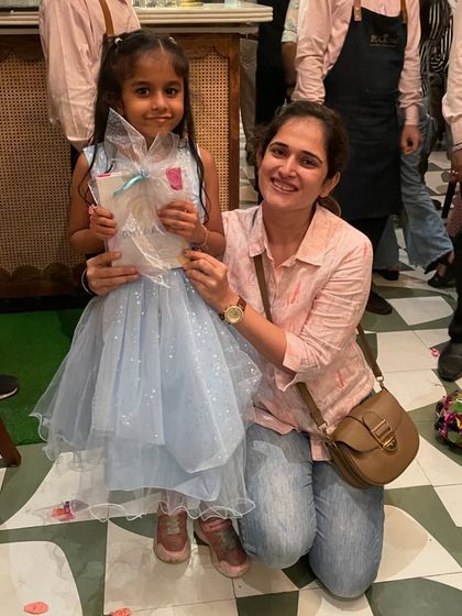 Another happy customer! Her sweet smile shows how much she enjoyed the creative experience and the beautiful art she gets to take home.