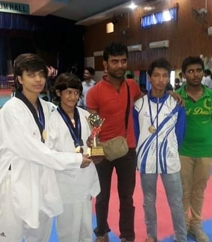 With my students celebrating their win with a trophy and medals. Every victory, big or small, is a testament to their dedication.