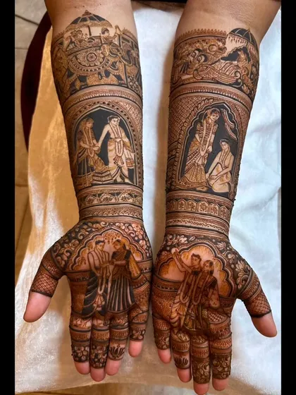 I love creating a full narrative on the arms. This bridal mehendi features multiple scenes from the wedding procession and key rituals, telling a complete story from the palms to the elbows.