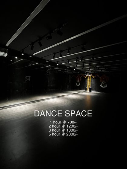 A clear, moody shot of the Jayanagar dance space with our hourly rental rates. This is your straightforward guide to booking this professional and atmospheric studio.
