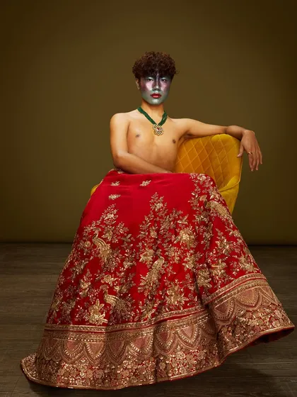 Where regal bridal aesthetics meet high-fashion drama. A student combines a traditional bridal lehenga with bold, silver face paint for an unforgettable look.