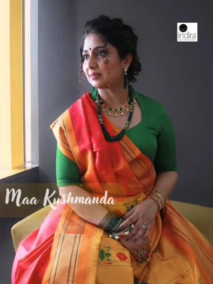 Representing Maa Kushmanda, this portrait uses natural window light to create a soft, ethereal glow. The vibrant orange and yellow saree, paired with a green blouse, brings warmth and energy to the image, reflecting the goddess's creative force.