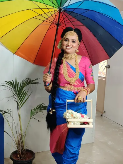 A full-length view of the Iyer Madisar drape. This style is unique in its construction and creates a very distinct and graceful silhouette.