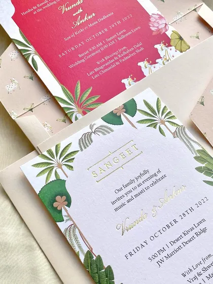 A closer look at the Sangeet and Wedding cards from the Arizona suite. The use of gold foil for the text adds a touch of luxury and helps it stand out against the vibrant, illustrated backgrounds.