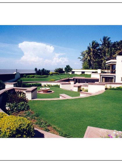 A view of the expansive, manicured lawn at our Daman project, overlooking the sea. The terraced garden design provides multiple levels for enjoyment and enhances the connection to the coastal landscape.