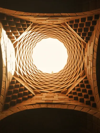 This is the oculus of an ornamental brick dome we created for a meditation space. The intricate corbelled brickwork is not just structural but also sculptural, playing with light and shadow to create a serene, inspiring atmosphere.