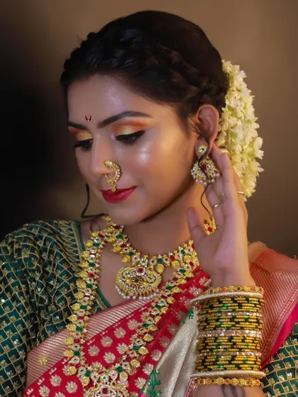 A classic pose showcasing the full Maharashtrian bridal look created for our Batch 7 students, complete with a floral bun and traditional attire.
