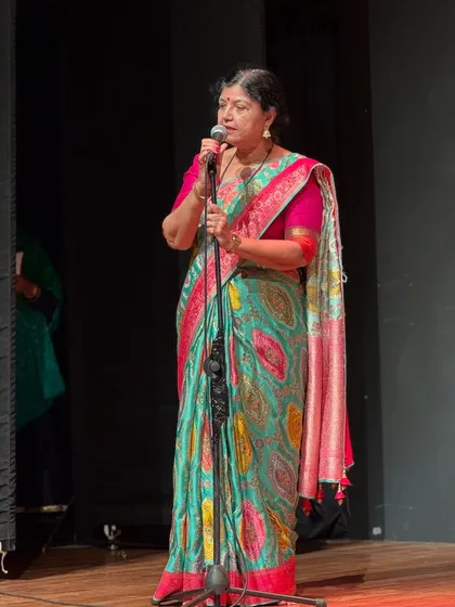 A heartfelt birthday wish for my Aai (mother). Here she is addressing the audience, a picture that captures her grace and warmth as both an artist and a teacher.