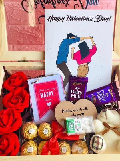 A beautiful Valentine's hamper featuring a custom illustration card. I filled this wooden box with roses, chocolates, and a teddy bear to create a box full of love.