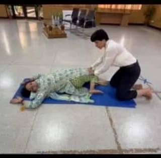 Demonstrating a stretching technique during the workshop. Practical demonstrations are a great way to teach correct form.