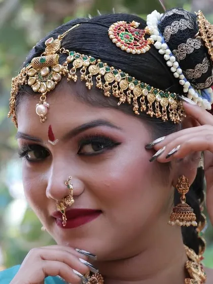 Another close-up showing the flawless makeup and the detailed craftsmanship of the hair accessories.