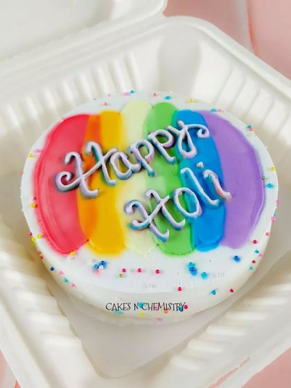 For a smaller, personal Holi treat, I offer these colorful bento cakes. This one is a simple yet vibrant chocolate cake with a "Happy Holi" message, perfect for sharing with a friend.
