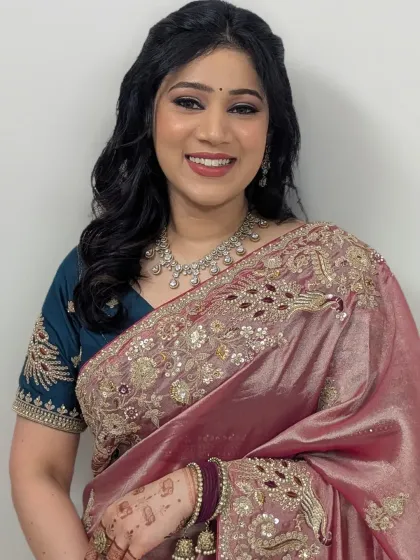 Timeless glam for a member of the bridal party. This look features a soft brown smokey eye, glowing skin, and a beautiful smile, perfect for any wedding event.