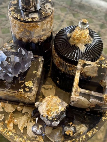 A detailed view of the bathroom organizer set, showing the crystal knob on the trinket box and the intricate details of the preserved flowers.