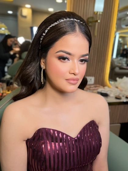 This client is the picture of elegance. The soft makeup and classic hairstyle are timeless.