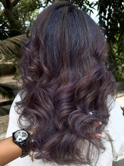 For my experimental clients like Bhakti, we love to play. This time we went for a cool purple and blue mix on her curly hair. The color looks so different after a few washes, fading into a beautiful pastel tone.
