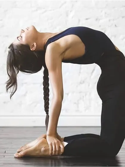 Ustrasana, or Camel Pose, is a deep backbend that opens the heart and stretches the entire front of the body.