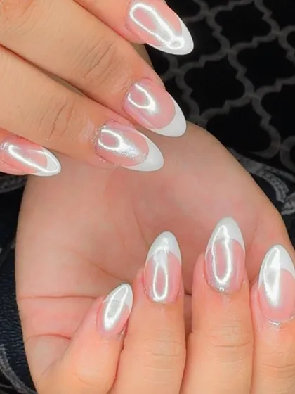 A stunning combination of a classic French manicure with a pearlescent holochrome finish for an ethereal glow.