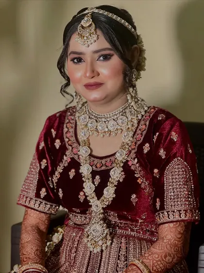 A beautiful portrait capturing her happy and confident expression. The lighting highlights the glow on her skin and the sparkle in her eyes.