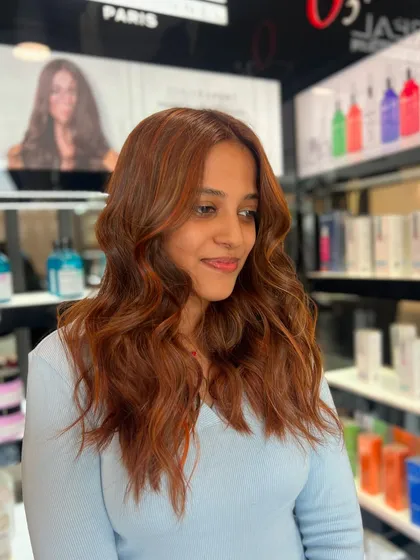 Copper hair, don't care. This client is rocking her fiery new shade with confidence, and the color perfectly complements her skin tone.