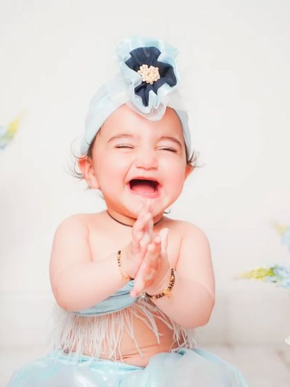 A big, happy laugh that lights up the room. We aim to capture your baby's true personality in every shot.