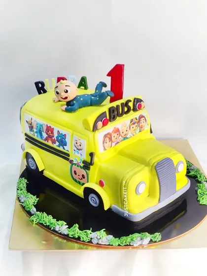 A Cocomelon cake shaped like the iconic yellow school bus. This fully-sculpted cake is a showstopper for any Cocomelon-themed party.