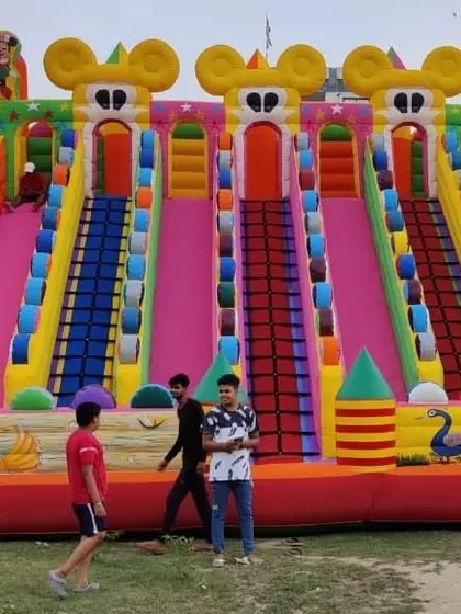 This big sliding bouncy features three main slides and detailed artwork, making it a premium attraction.