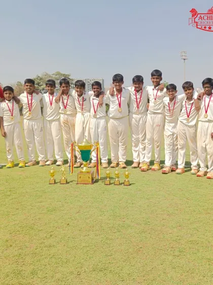 Our U-12 boys team with coaches and the championship trophy after winning the ASMC U-12 tournament.