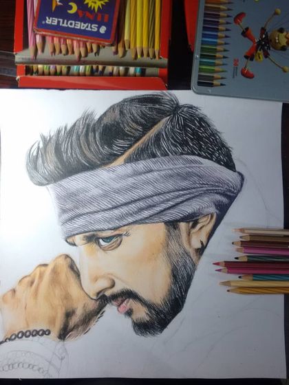 A work-in-progress shot of my Kiccha Sudeep drawing. This shows the artwork before the background and final details are added, giving a glimpse into my creative process.