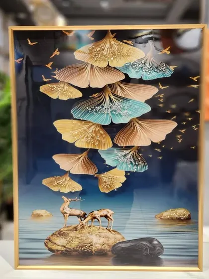 This crystal painting showcases a beautiful scene of deer by the water under falling ginkgo leaves. The 16x24 inch piece is full of intricate detail and has a glossy, textured finish that brings a touch of elegance and nature indoors.