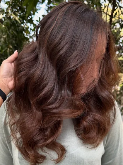 This is my 'Chocolate Pecan Dream' creation. We started with a faded base and gave her this incredibly rich, warm brown with delicate pecan highlights. The result is a glossy, healthy-looking color that’s perfect for any season.