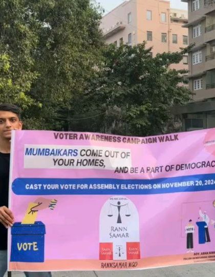 Two young students holding our campaign banner. Their involvement in spreading awareness is a testament to the power of youth in driving social change.