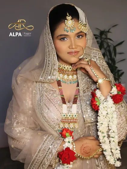 This shot captures the intricate details of the jewelry and the subtle shimmer on the eyelids, perfect for a reception or Valima.