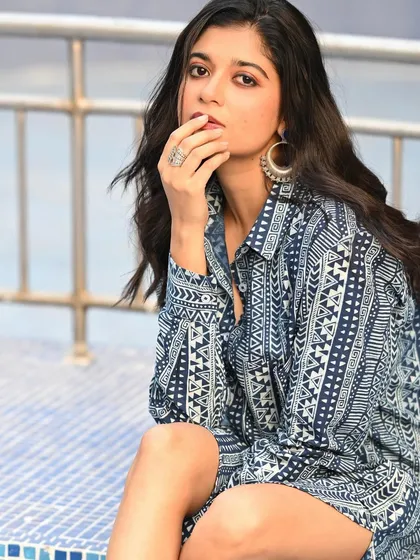 Another angle from the same series, with the model's hand gently touching her face. This pose is classic and elegant, highlighting her features.