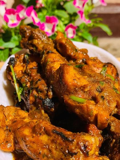Another shot of the delicious chicken curry, with flowers from my garden in the background.