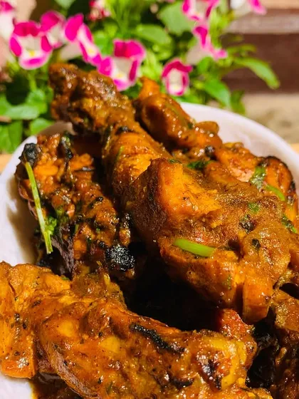 Another shot of the delicious chicken curry, with flowers from my garden in the background.