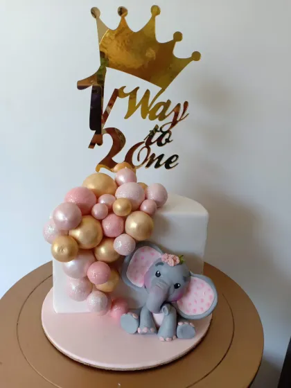 This was one of my early designs from 2018, featuring a cute elephant and a cascade of pink and gold balloons for a half-birthday celebration. It’s fun to look back and see how my style has evolved, but the love for cute, handcrafted details has always been there.
