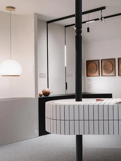 A detail shot from our ACETECH 2023 booth, showing a pendant light and magnetic track system. The design focused on creating distinct zones and using lighting to guide circulation and highlight products in an artful way.