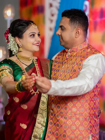 Swapnil and Ankita share a dance during their engagement party. The warm lighting and their happy expressions make this a wonderful memory.