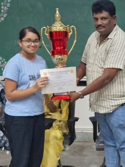 Anandhi P proudly holds her trophy after winning the SILVER medal at the State under 19 Girls Chess championships, securing her spot at the nationals.