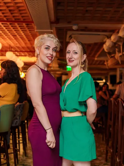 Guests dressed in vibrant colors, adding to the lively atmosphere of the throwback night.